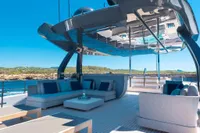 Luxurious 2020 Custom Line Navetta 33 yacht deck with modern seating and ocean view.