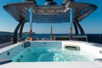 Luxurious hot tub on Custom Line Navetta 33 yacht, 2020 model, with ocean view.