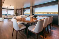 Luxurious dining area on 2020 Custom Line Navetta 33 yacht with ocean view.