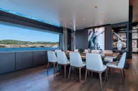 Luxurious dining area on 2020 Custom Line Navetta 33 yacht with ocean view.