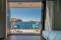 Luxurious 2020 Custom Line Navetta 33 yacht with ocean view from cabin.
