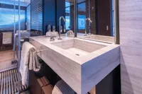 Luxurious bathroom on Custom Line Navetta 33 yacht, featuring modern sink and elegant design.