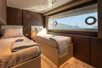 Luxurious twin bedroom on 2020 Custom Line Navetta 33 yacht with ocean view.