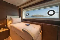 Luxurious cabin interior of 2020 Custom Line Navetta 33 yacht with scenic window view.