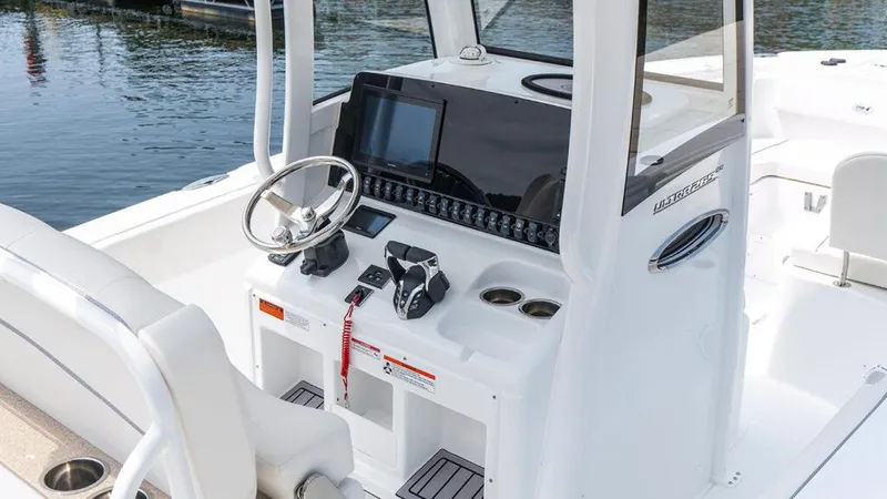  Yacht Photos Pics 2025 Sea Hunt Ultra 265 SE boat console with steering wheel and navigation display.