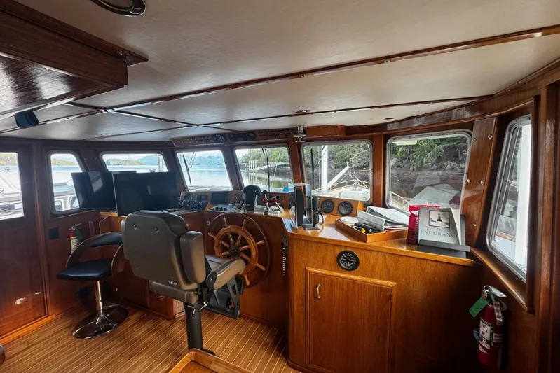 Shackleton Yacht Photos Pics Interior of 1982 Miller Marine North Sea Trawler, featuring wooden helm and navigation equipment.
