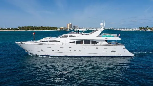  Yacht Photos Pics Luxurious 1999 Azimut 5 Stateroom VIP Edition yacht cruising on clear blue waters.