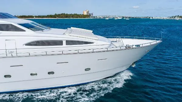  Yacht Photos Pics Luxurious 1999 Azimut 5 Stateroom VIP Edition yacht cruising on blue ocean waters.