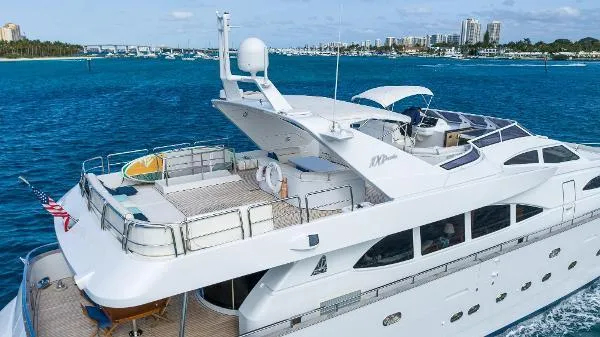  Yacht Photos Pics Luxurious 1999 Azimut 5 Stateroom VIP Edition yacht cruising in clear blue waters.