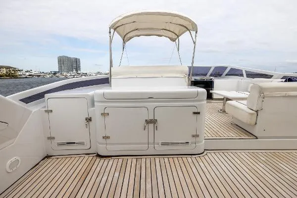  Yacht Photos Pics Luxurious 1999 Azimut 5 Stateroom VIP Edition yacht deck with seating and storage.