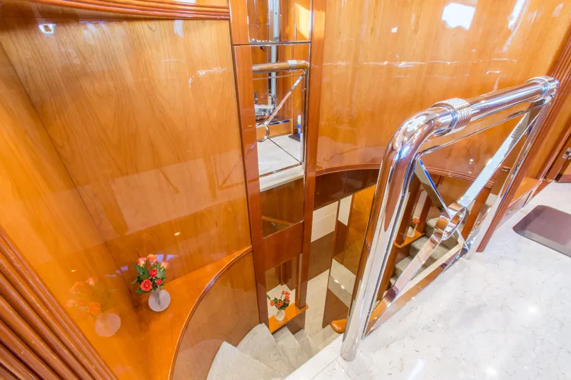  Yacht Photos Pics Luxurious wooden staircase with chrome railing on 1999 Azimut 5 Stateroom VIP Edition yacht.