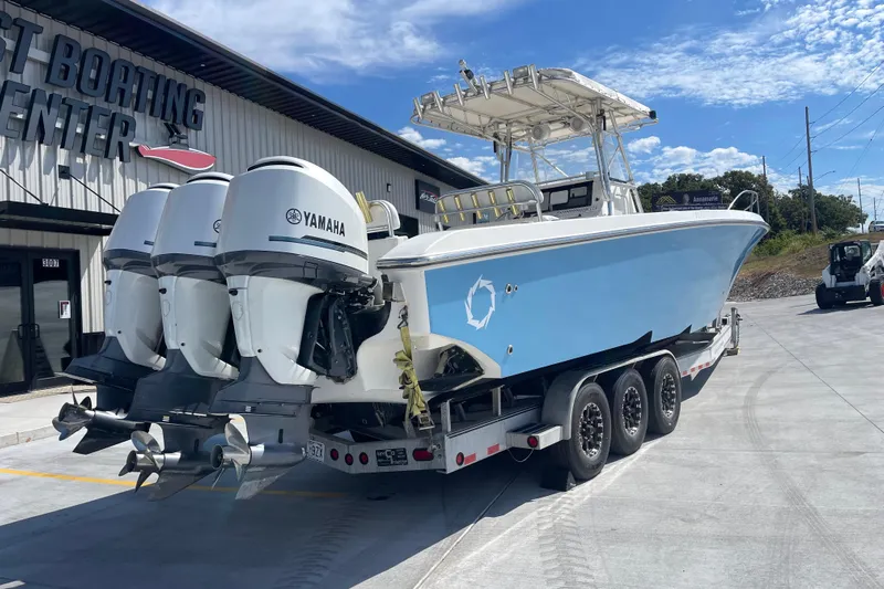  Yacht Photos Pics 2002 Fountain 38 CC Tournament Edition boat with Yamaha engines on a trailer.