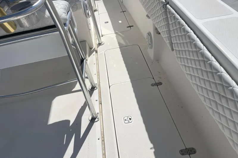  Yacht Photos Pics 2002 Fountain 38 CC Tournament Edition boat deck with quilted seating and metal railings.