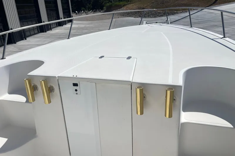 Yacht Photos Pics 2002 Fountain 38 CC Tournament Edition boat deck with gold rod holders.