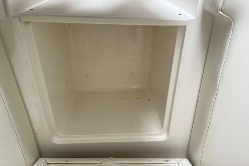  Yacht Photos Pics Empty storage compartment on a 2002 Fountain 38 CC Tournament Edition boat.