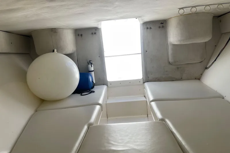  Yacht Photos Pics Interior cabin of 2002 Fountain 38 CC Tournament Edition boat with seating and equipment.