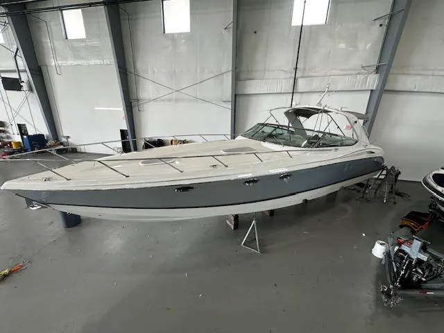  Yacht Photos Pics 2005 Formula 400 SS boat in a storage facility, showcasing sleek design and spacious deck.