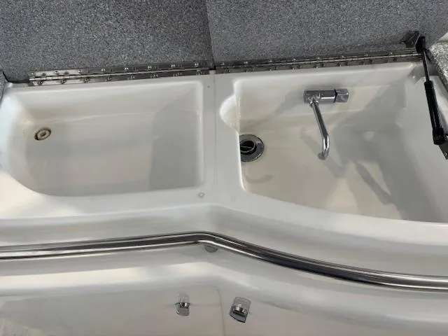  Yacht Photos Pics Dual sink setup in a 2005 Formula 400 SS boat, featuring stainless steel fixtures.