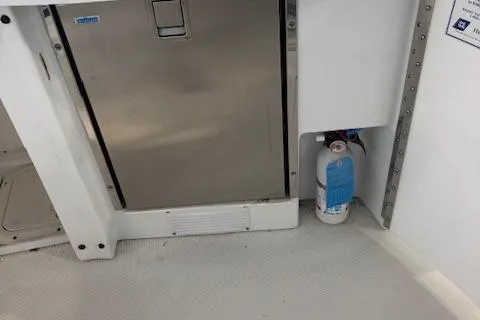  Yacht Photos Pics 2005 Formula 400 SS boat interior with stainless steel appliance and fire extinguisher.