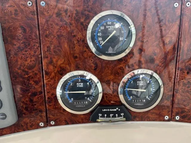  Yacht Photos Pics Dashboard of 2005 Formula 400 SS with speedometer and RPM gauges on wood panel.