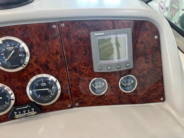 Yacht Photos Pics Dashboard of 2005 Formula 400 SS boat with gauges and Raymarine display.