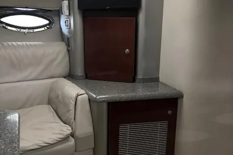  Yacht Photos Pics Interior of 2005 Formula 400 SS boat with leather seating and wooden cabinetry.