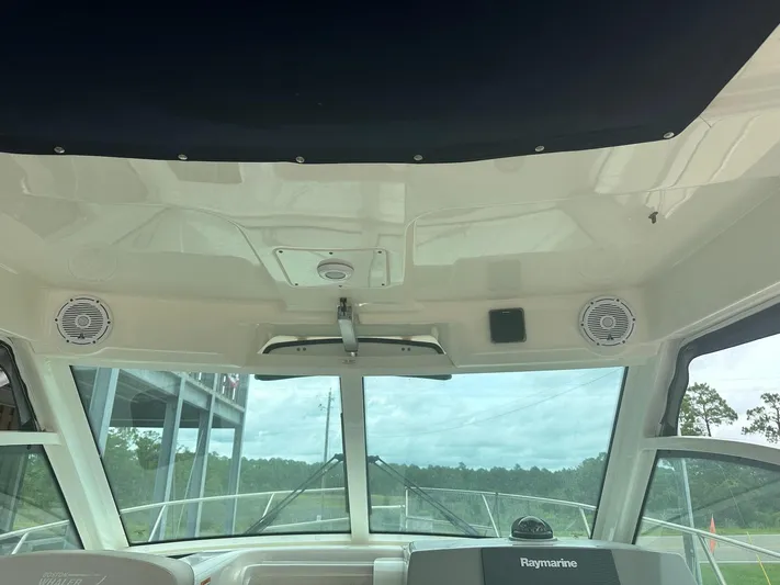 Thomfoolery II Yacht Photos Pics Interior view of 2016 Boston Whaler 315 Conquest boat with Raymarine equipment.