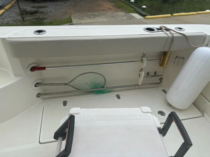 Thomfoolery II Yacht Photos Pics 2016 Boston Whaler 315 Conquest deck with fishing net and fender storage.