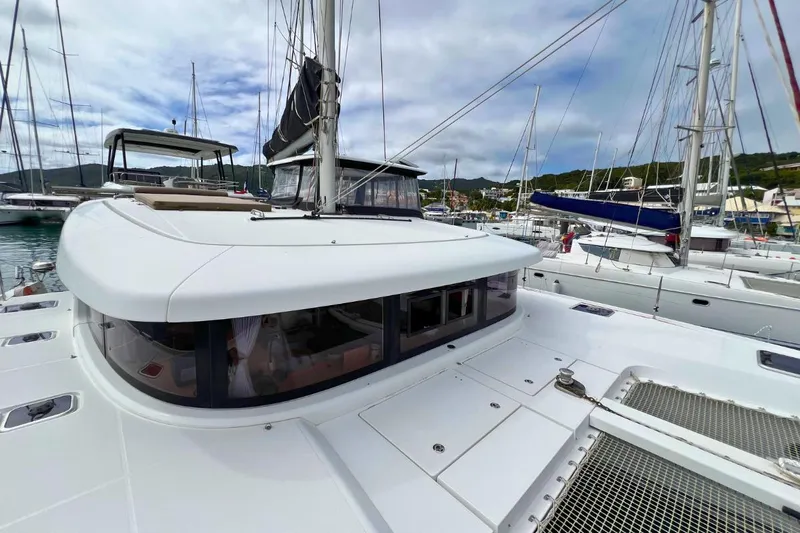 Mocean Yacht Photos Pics 2017 Lagoon 42 catamaran docked in marina, showcasing sleek design and spacious deck.