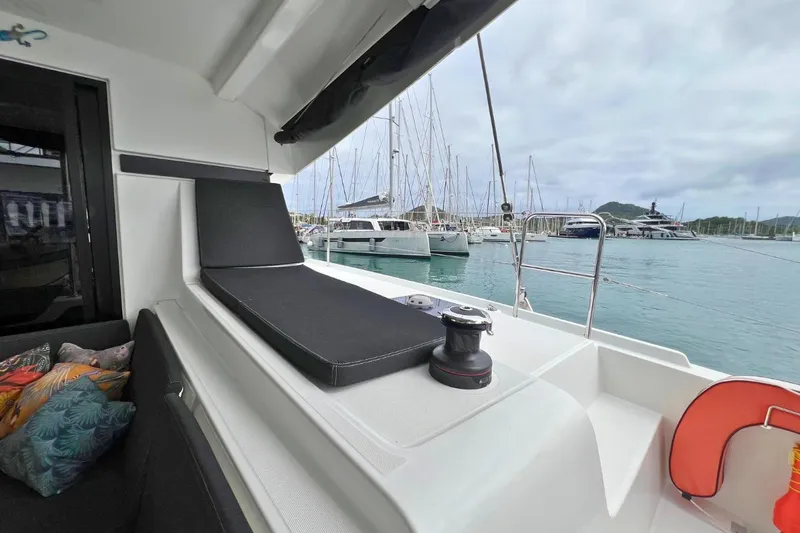 Mocean Yacht Photos Pics Lagoon 42 catamaran deck view, 2017 model, docked in marina with scenic background.