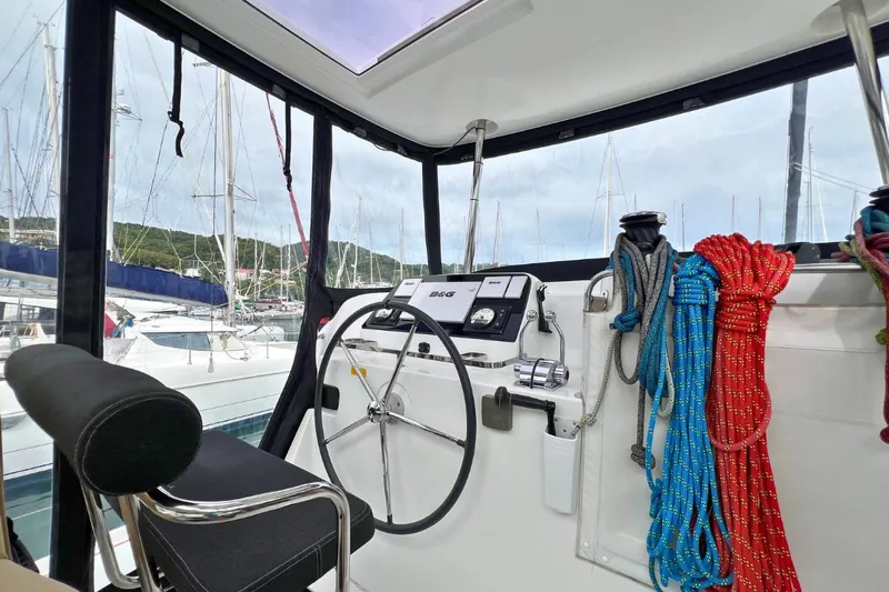 Mocean Yacht Photos Pics Helm of 2017 Lagoon 42 catamaran with ropes and navigation equipment.