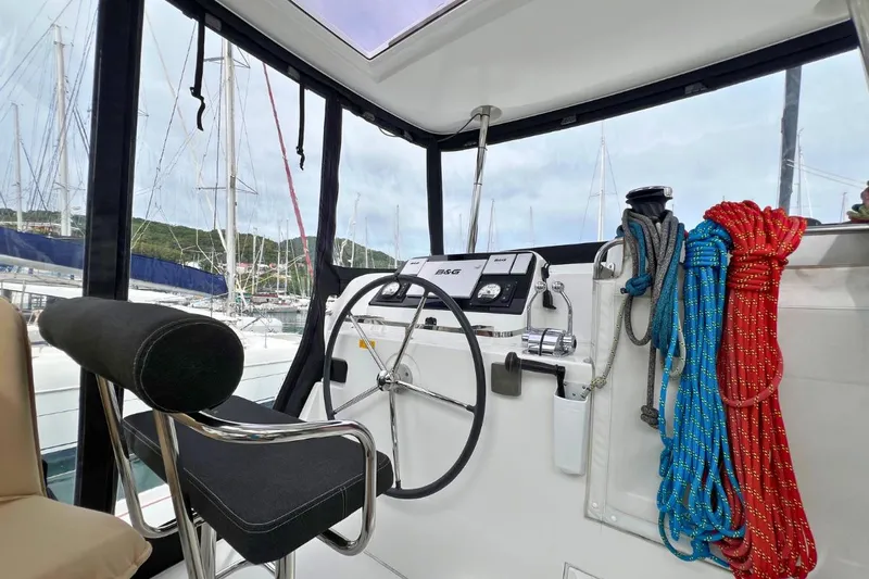 Mocean Yacht Photos Pics Helm of 2017 Lagoon 42 catamaran with steering wheel and colorful ropes.