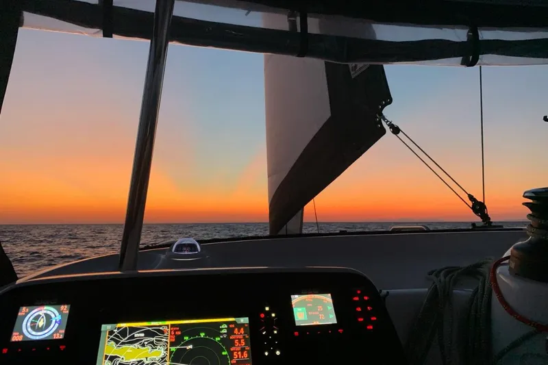 Mocean Yacht Photos Pics Sunset view from 2017 Lagoon 42 catamaran cockpit with navigation screens.