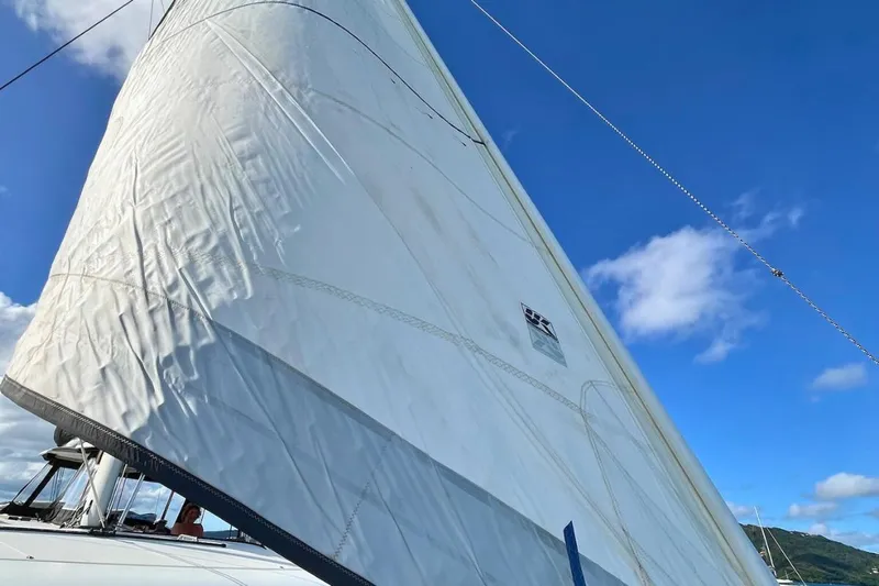 Mocean Yacht Photos Pics Sailing yacht Lagoon 42, 2017 model, with white sails against a clear blue sky.