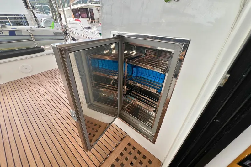 Mocean Yacht Photos Pics Open storage compartment on 2017 Lagoon 42 yacht with wooden deck.