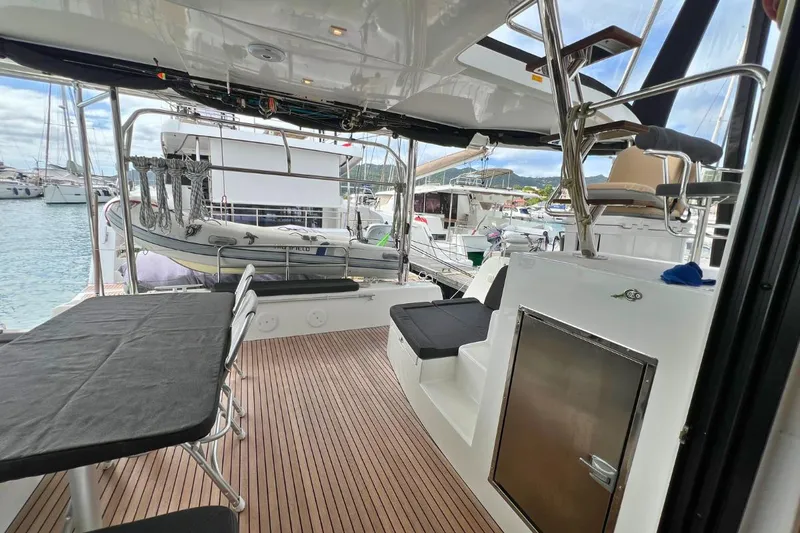Mocean Yacht Photos Pics Spacious deck of 2017 Lagoon 42 catamaran with seating and marina view.