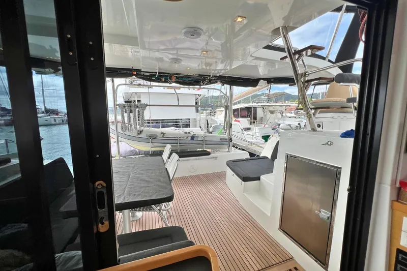 Mocean Yacht Photos Pics 2017 Lagoon 42 yacht interior with seating area and marina view.
