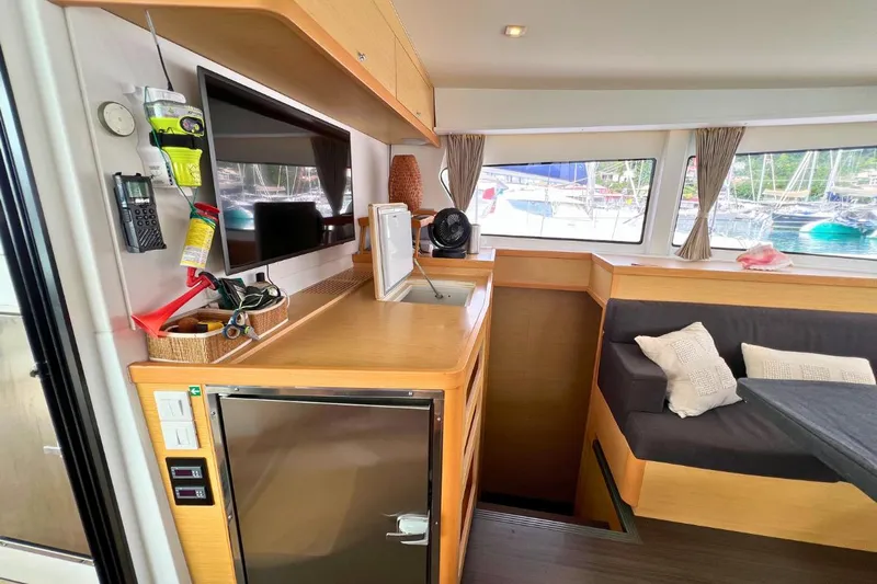 Mocean Yacht Photos Pics Interior of 2017 Lagoon 42 catamaran with modern kitchen and cozy seating area.