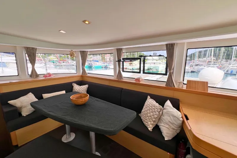 Mocean Yacht Photos Pics Interior of 2017 Lagoon 42 catamaran with cozy seating and large windows.