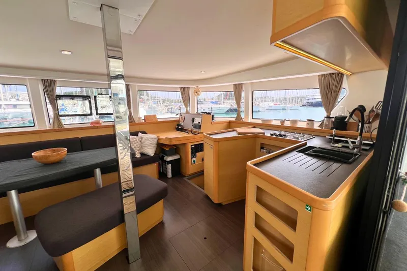 Mocean Yacht Photos Pics Spacious interior of 2017 Lagoon 42 catamaran with modern kitchen and seating area.