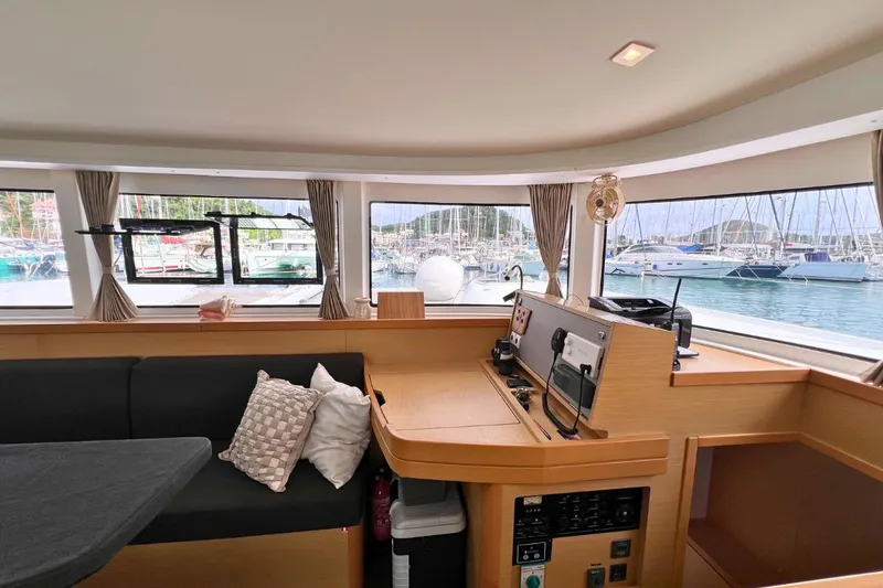 Mocean Yacht Photos Pics Interior of 2017 Lagoon 42 catamaran with marina view through large windows.