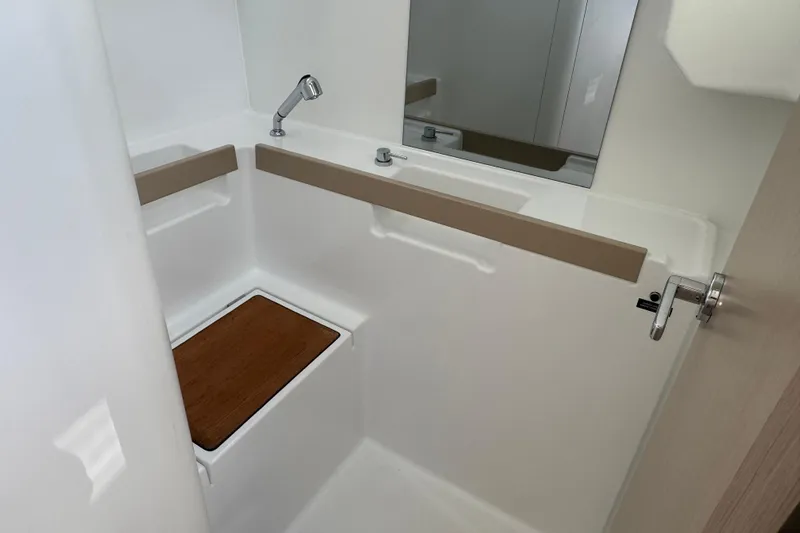  Yacht Photos Pics 2023 Beneteau Oceanis 38.1 bathroom with modern fixtures and wooden accents.