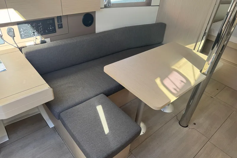  Yacht Photos Pics Interior of 2023 Beneteau Oceanis 38.1 yacht with modern seating and table.