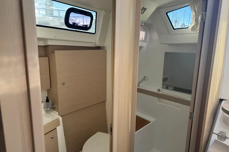  Yacht Photos Pics Interior view of 2023 Beneteau Oceanis 38.1 yacht bathroom with modern fixtures.