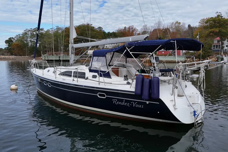 Rendez-vous Yacht Photos Pics 2003 Catalina 387 sailboat named "Rendez-Vous" docked in a serene marina setting.
