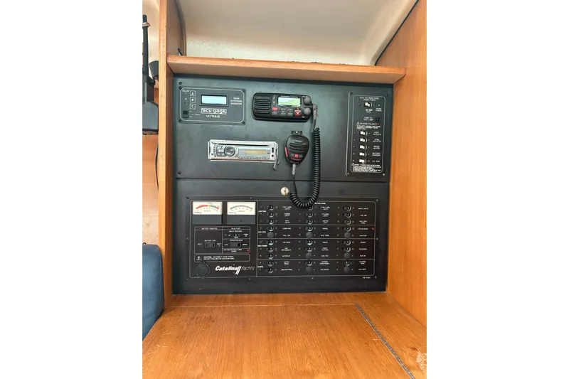 Rendez-vous Yacht Photos Pics Electrical control panel in a 2003 Catalina 387 sailboat interior.