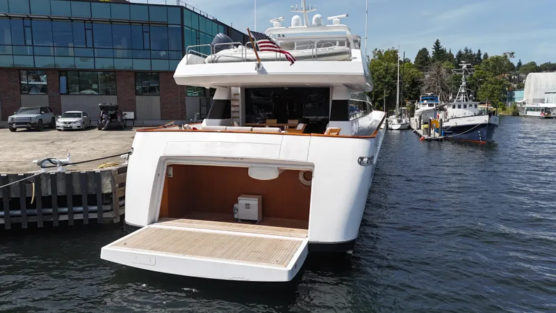 Arrivederci IV Yacht Photos Pics 1998 Cantieri di Pisa AKHIR yacht docked at marina, rear view with open swim platform.