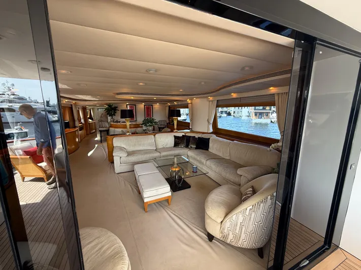 Arrivederci IV Yacht Photos Pics Luxurious interior of 1998 Cantieri di Pisa AKHIR yacht with elegant seating and large windows.