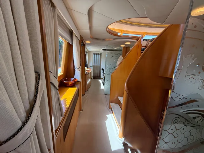 Arrivederci IV Yacht Photos Pics Luxurious interior of 1998 Cantieri di Pisa AKHIR yacht with elegant wood and glass design.