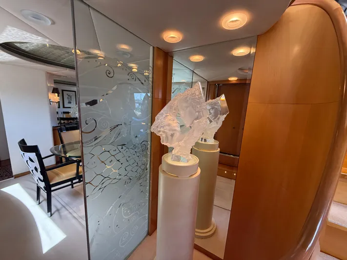 Arrivederci IV Yacht Photos Pics Luxurious interior of 1998 Cantieri di Pisa AKHIR yacht with elegant decor and glass accents.